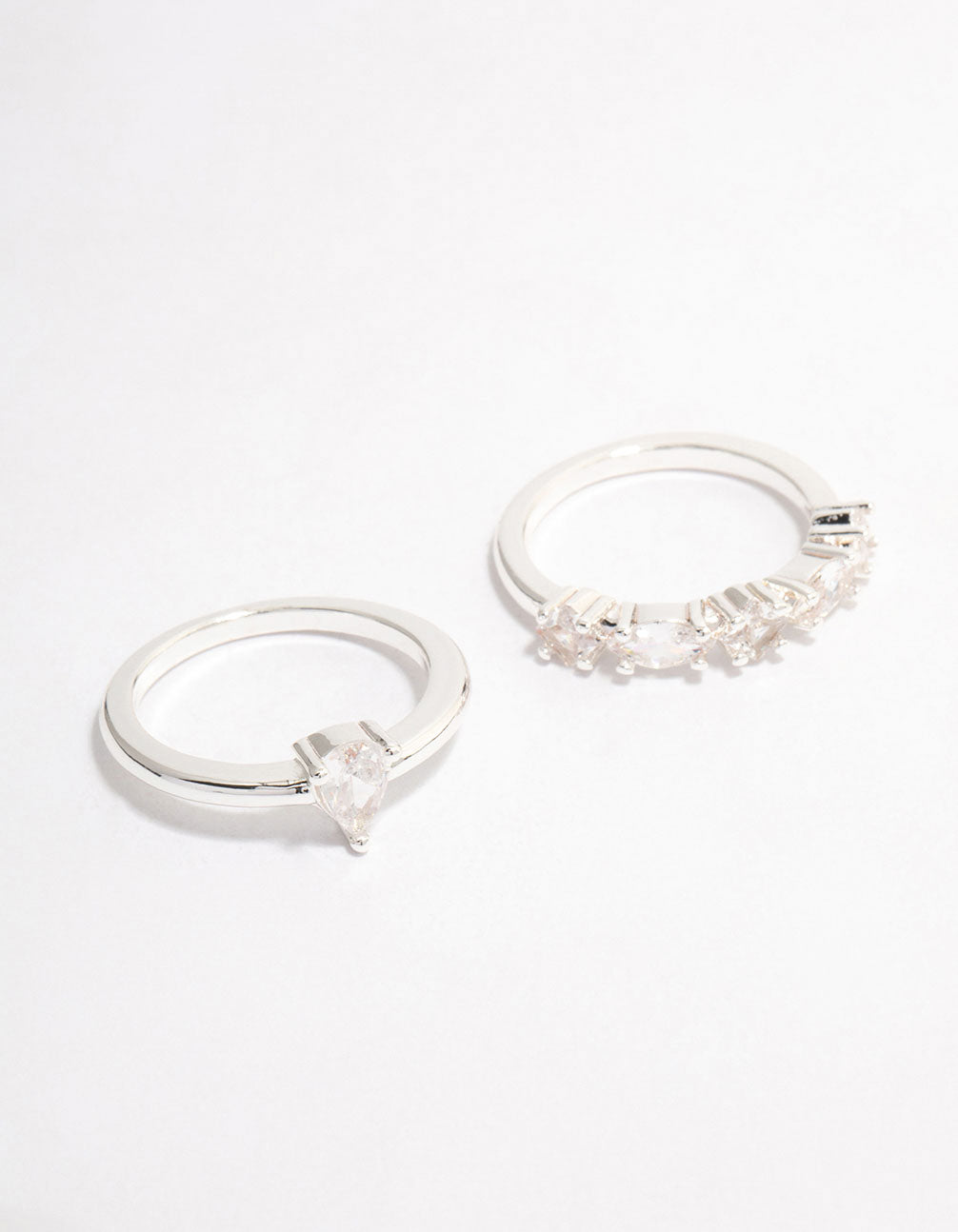 Silver plated alternating pear stacking rings with stone cut details front view
