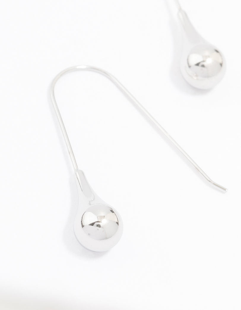 Featuring waterproof stainless steel thread through earrings with ball detail in silver close up view