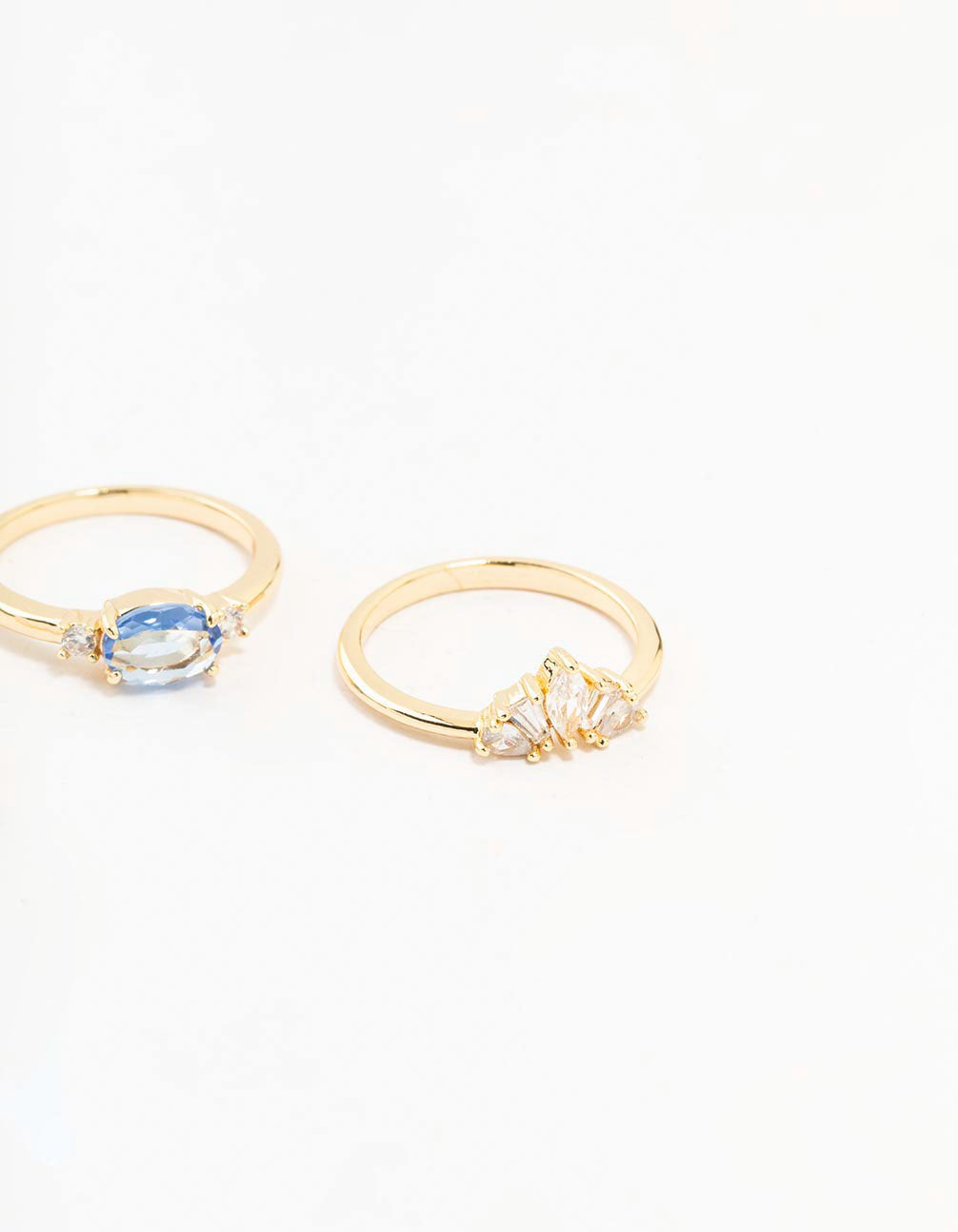 Elegant gold plated blue stone and fan cubic zirconia ring pack designed with crystal details side detail view