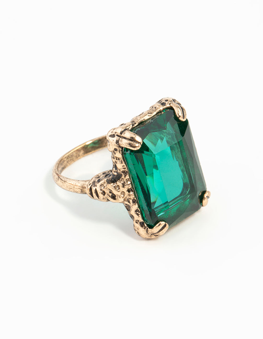 Showcasing an emerald square cut stone on gold band with textured setting side detail view