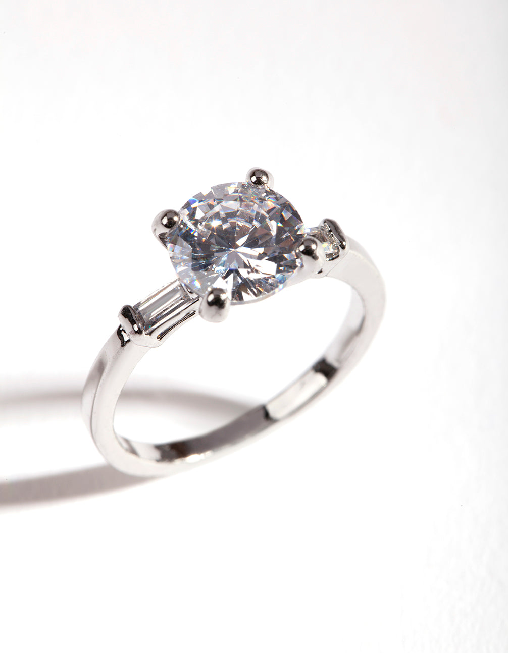 Showcasing a silver cubic zirconia round stone band ring with prong setting front view