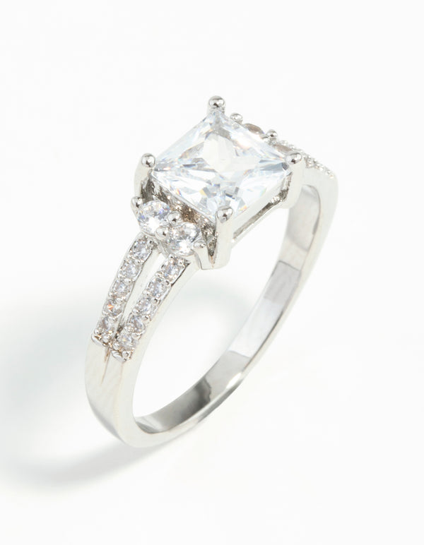 Elegant silver cubic zirconia square stone ring with princess cut center and pave accents side detail view