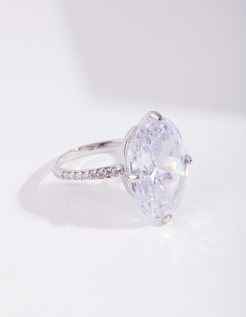 Featuring a silver cubic zirconia large oval stone ring with crystal and statement design front view