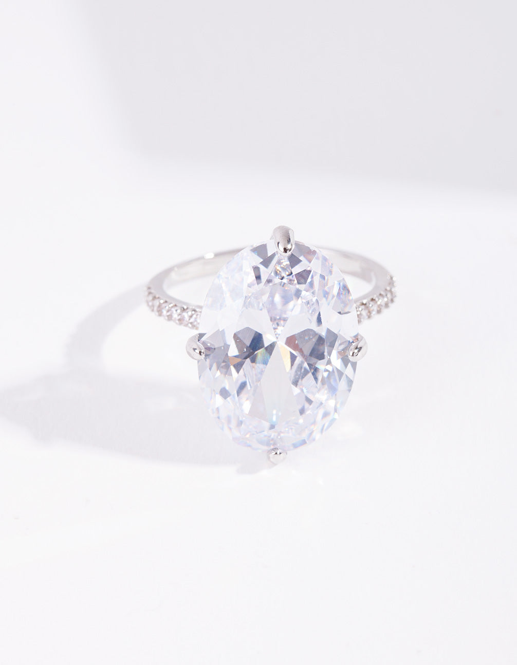 Crafted with silver cubic zirconia large oval stone ring featuring crystal and statement design close up view