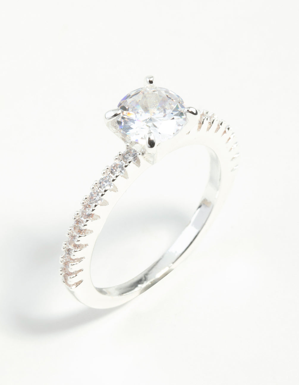 Featuring a silver plated round cubic zirconia textured band ring with clear accents side detail view