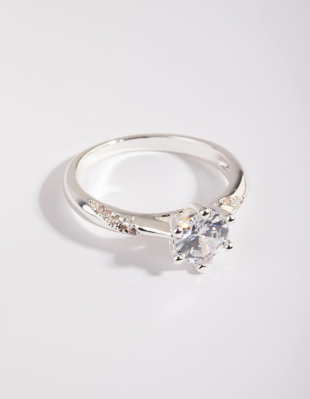 Stunning silver plated twisted ring with cubic zirconia in a dainty style close up view