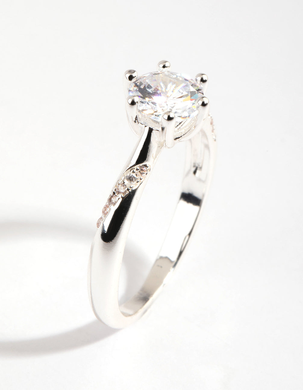 Beautifully crafted silver plated twisted ring with cubic zirconia in a dainty style side detail view