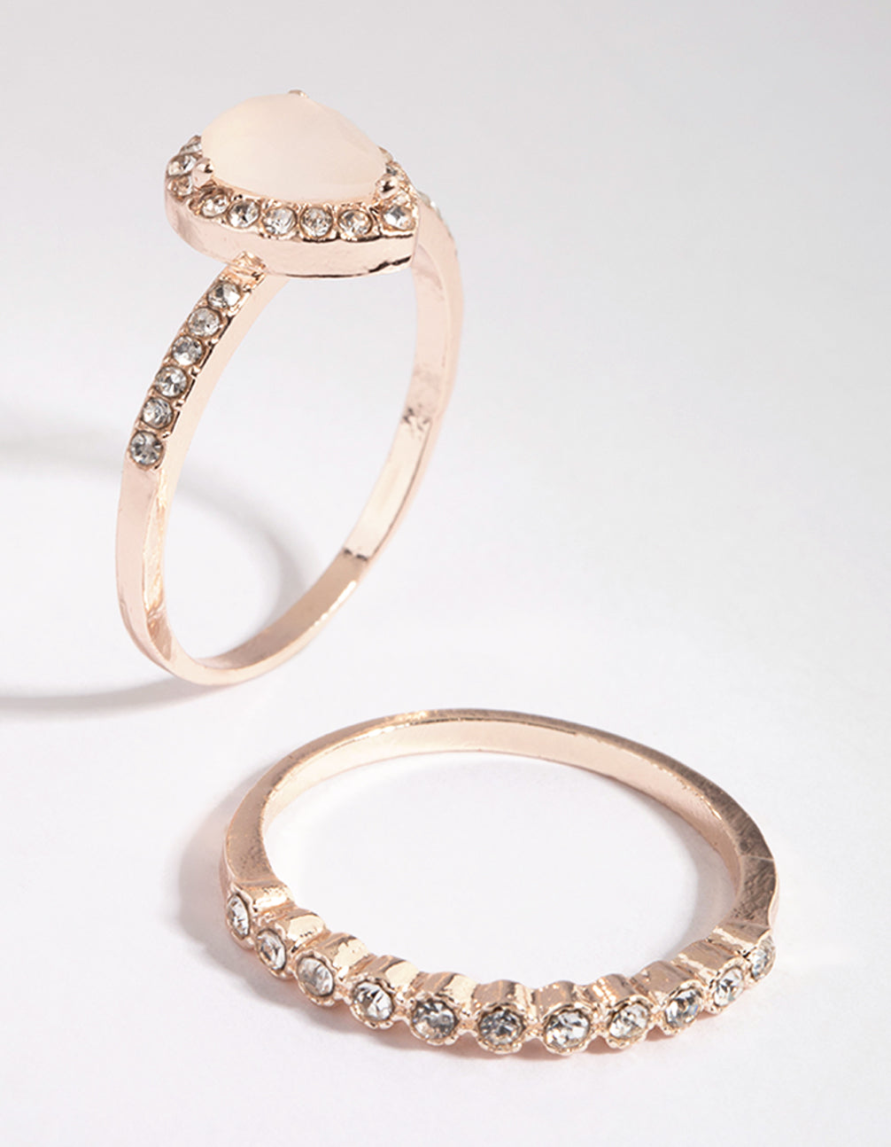 Detailed rose gold cat eye ring stack pack highlighting gemstone settings post detail view