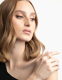 Showcasing a rose gold vine wrapped ring with leaf accents on finger view - link has visual effect only