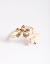 Elegant gold diamante and cateye flower ring accents in statement design side detail view - link has visual effect only