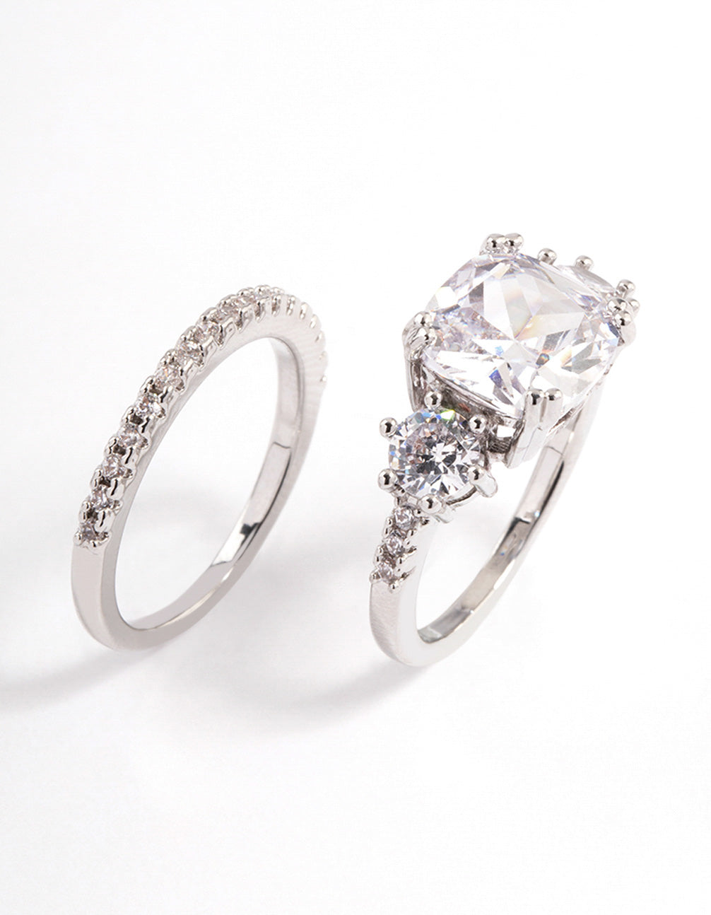 Elegant triple stone ring set crafted from silver with clear gemstones side detail view