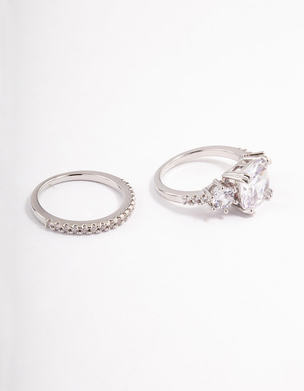 Beautifully designed triple stone ring set in silver with clear gemstones close up view