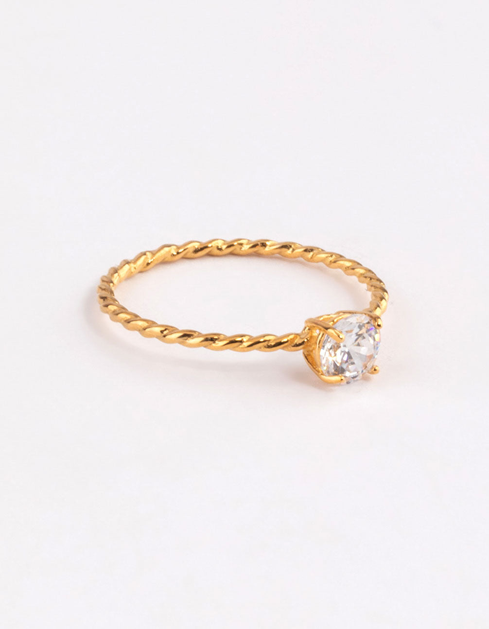 Showcasing a gold plated sterling silver cubic zirconia twist engagement ring with clear accents side detail view