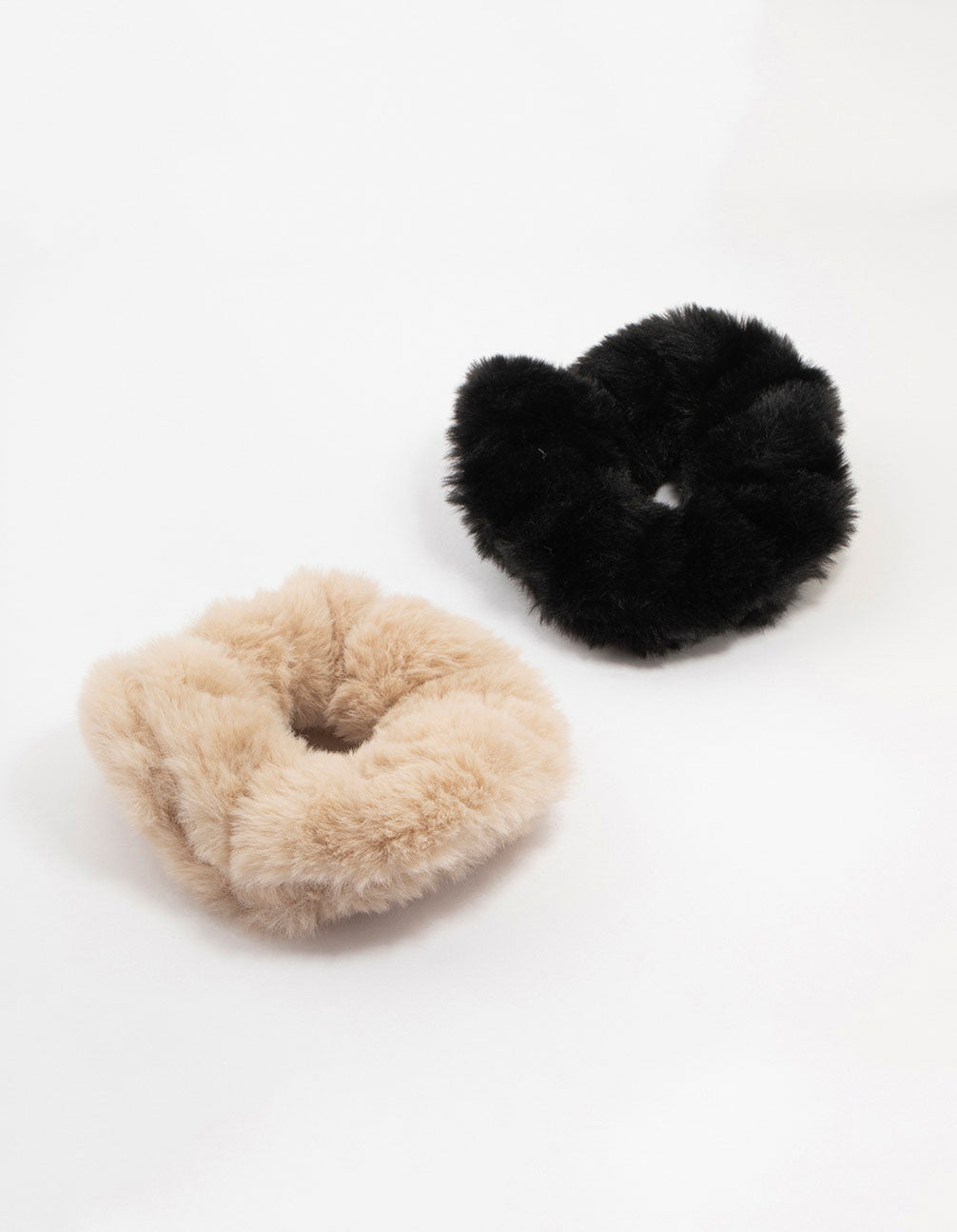 Discover solid faux fur scrunchies in a 2-pack featuring black and tan front view