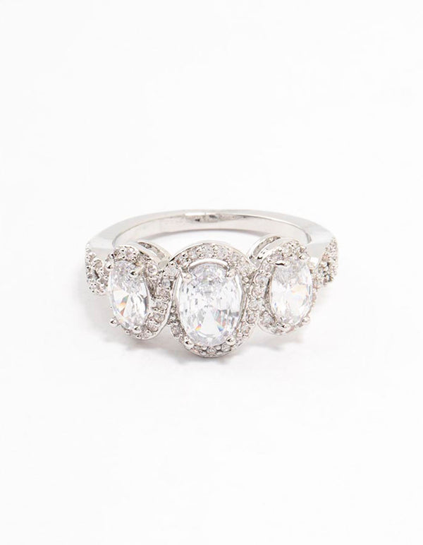 Stunning ring crafted with three oval cut cubic zirconia stones and halo details in silver close up view