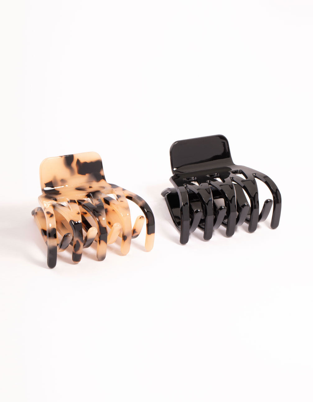 Set of small acrylic zig zag claw clips in tortoiseshell pattern, featuring black, saddle brown, and yellow colors, 2-pack side view