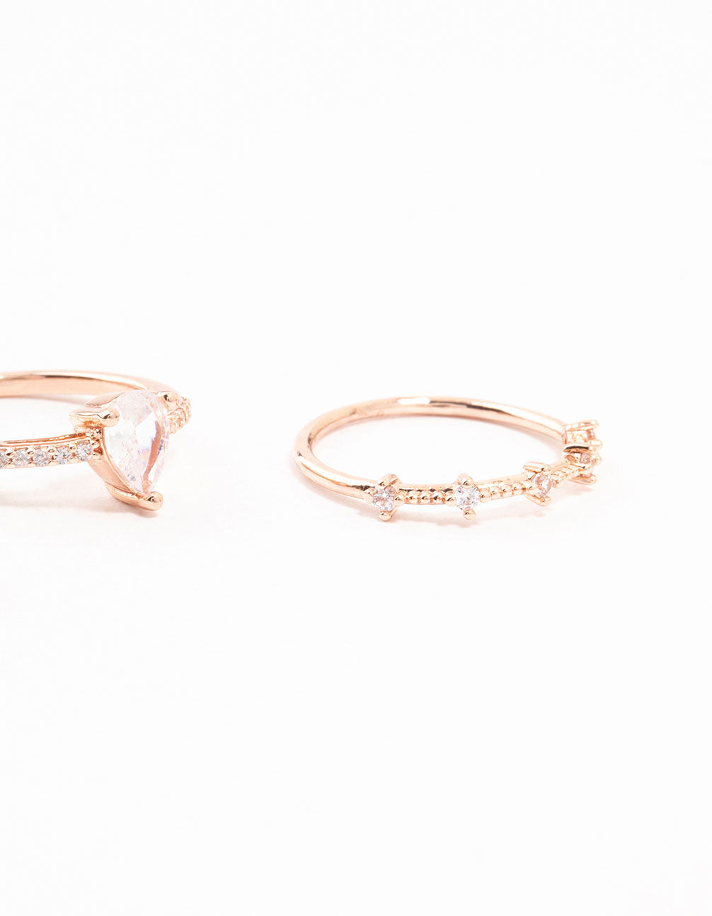 Crafted with rose gold plated elegant pear stacking rings in a 3-pack close up view
