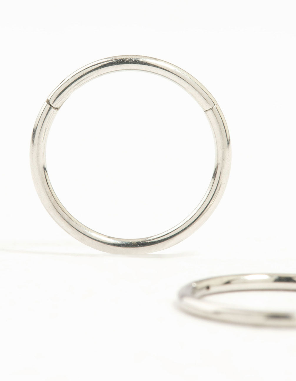 Showcasing surgical steel medium sleeper earrings in silver, 10 mm close up view