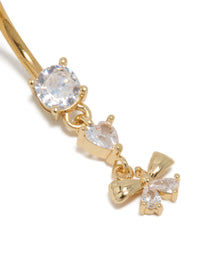 Featuring a gold plated surgical steel belly bar with bow charm, and cubic zirconia close up view - link has visual effect only