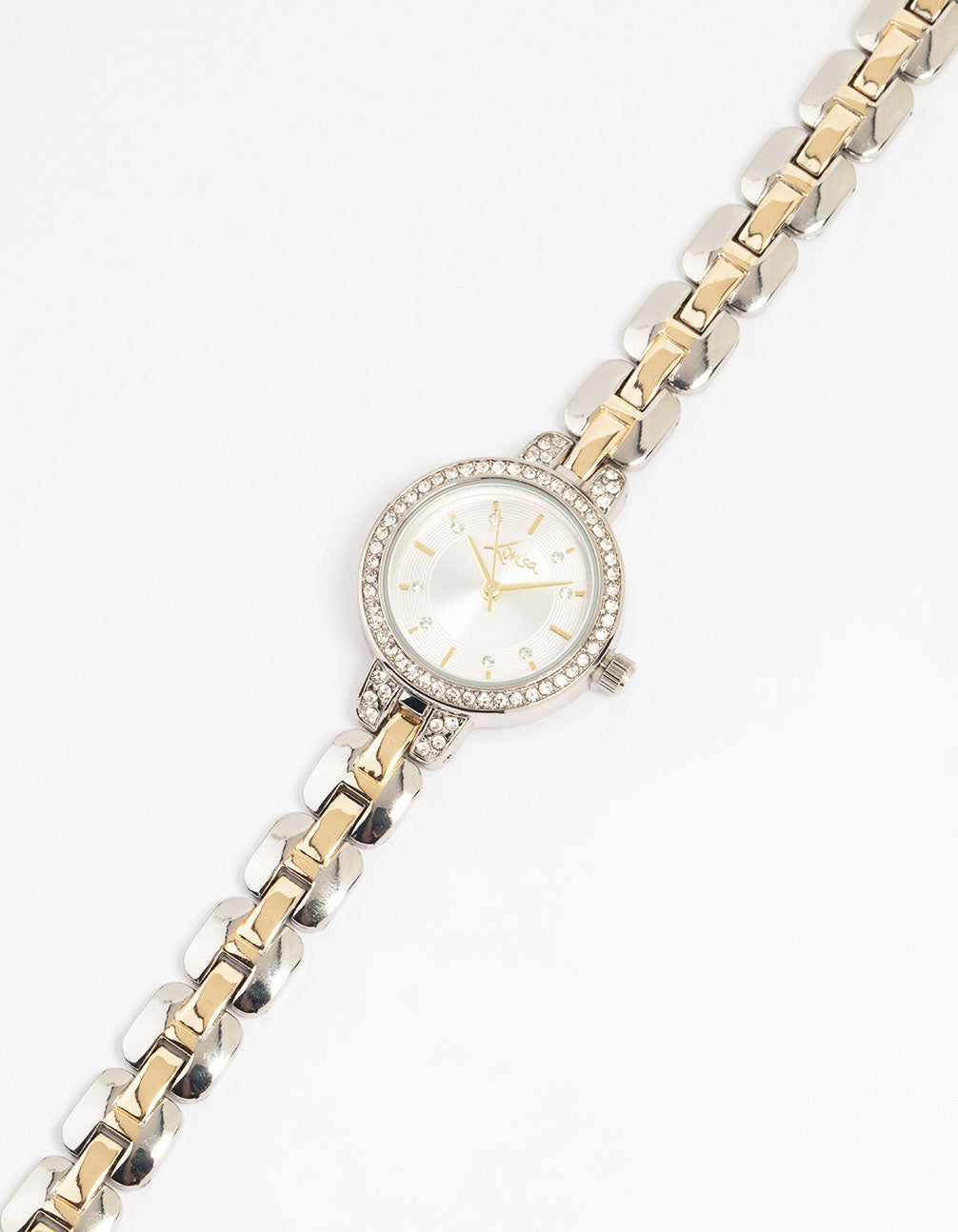 Crafted from mixed metals with a white dial and clear stones, round shape, diamante small watch featuring multi-color link band designed for women analog casual wear watch face detail view