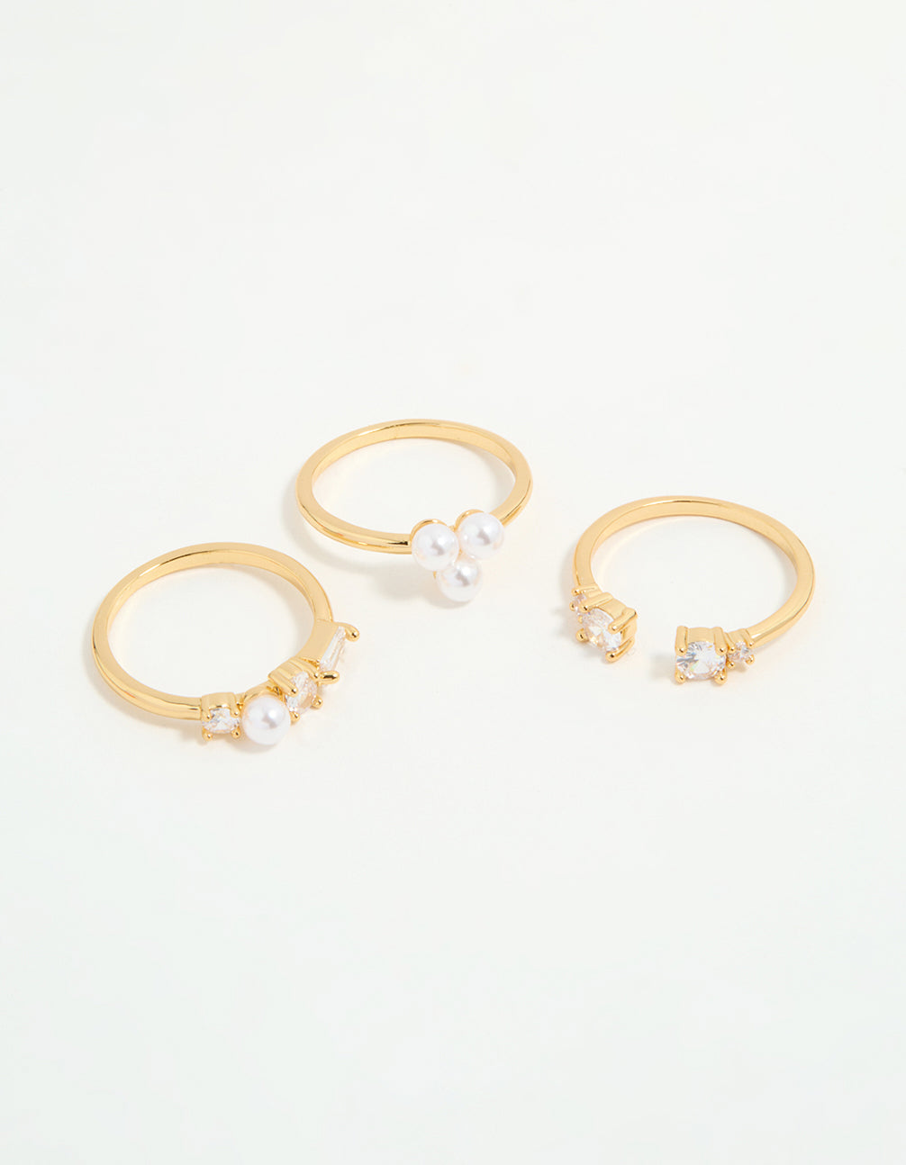 Featuring gold plated cubic zirconia and pearl rings in a 3-pack front view