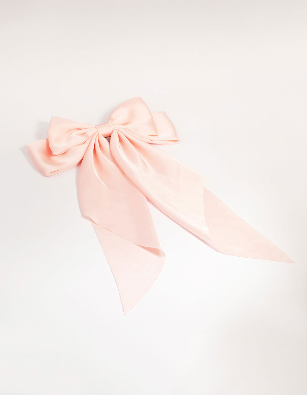 Discover this pink satin fabric bow barrette clip with solid print front view