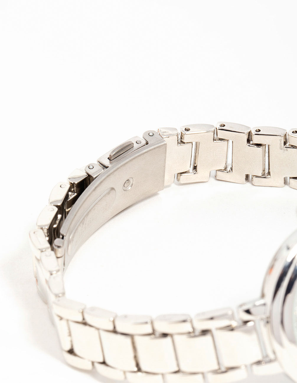 Sophisticated women's watch with white stone-embellished dial, round shape, formal occasion design, link-band strap in silver, and analog display front view