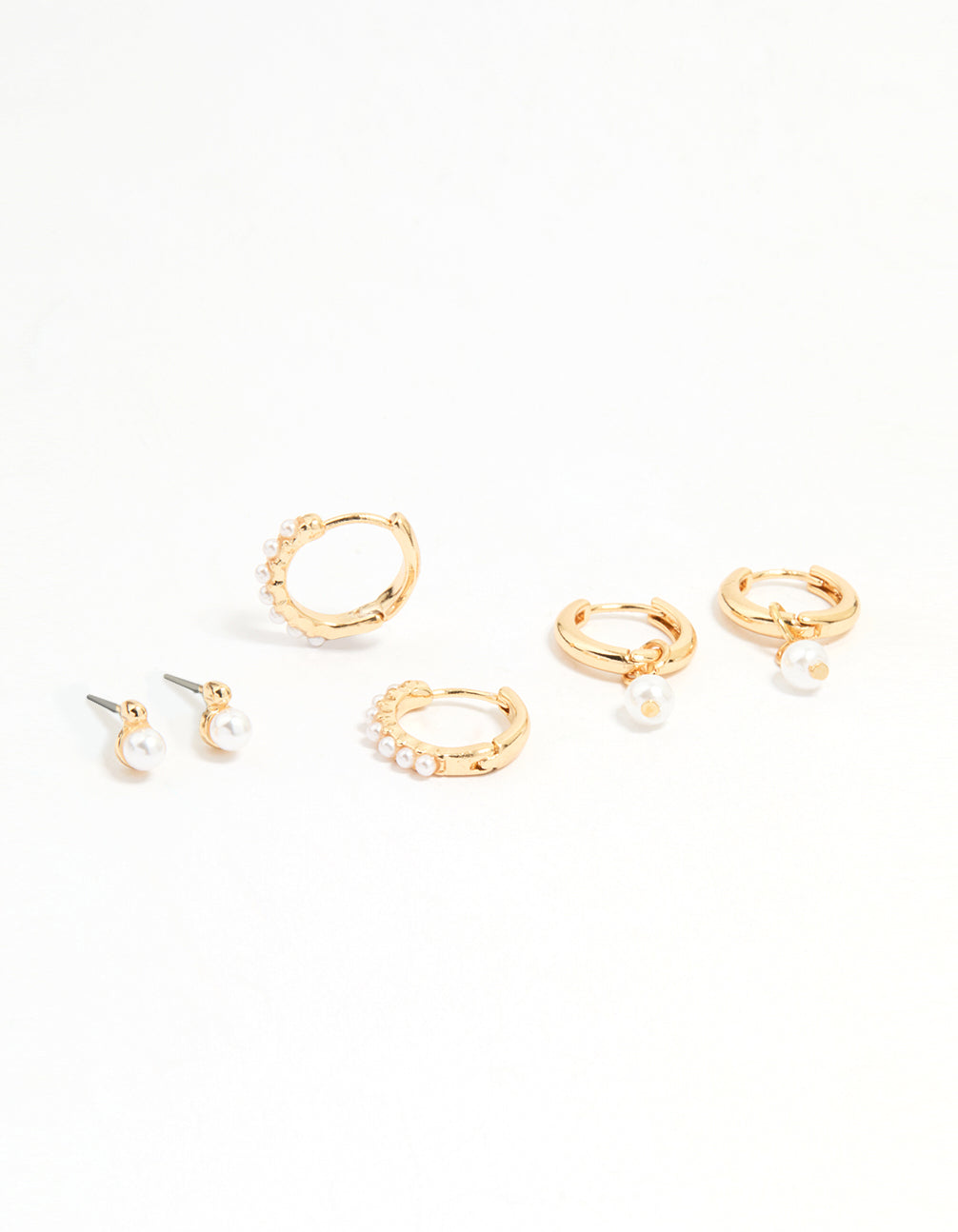 Featuring gold mixed pearl huggie earrings in a 3-pack front view