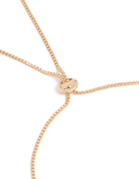 Close look at gold cubic zirconia butterfly and flower toggle bracelet in white with closure detail view - link has visual effect only