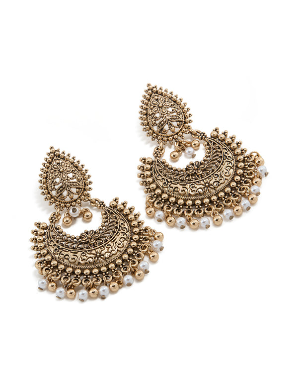 Featuring antique gold teardrop pearl boho earrings with beads, charm details, and floral design front view