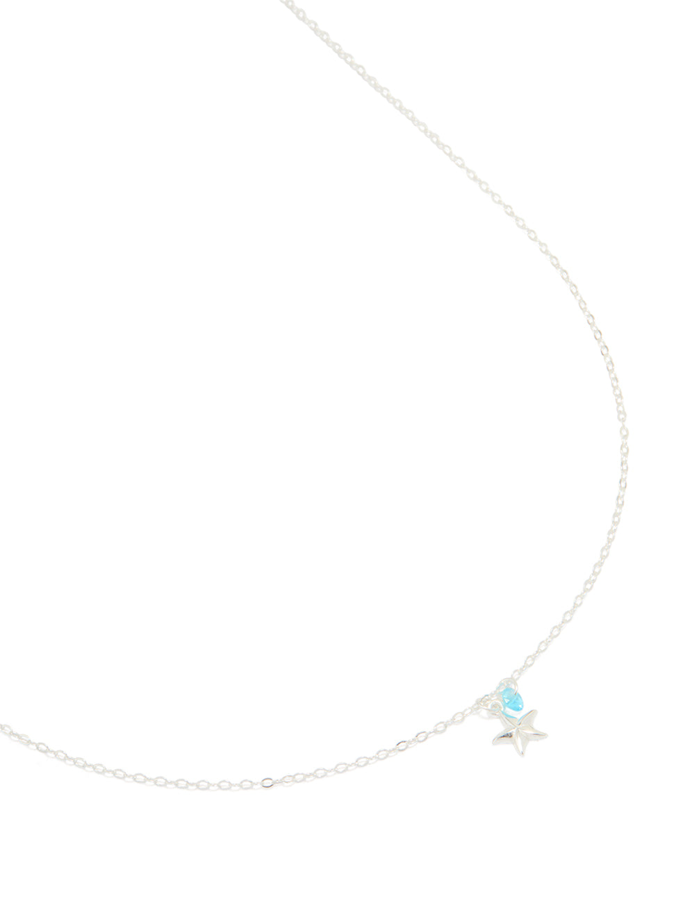 Crafted from sterling silver, this blue cubic zirconia and starfish pendant necklace features ocean-inspired charm details in a delicate crystal design close up view