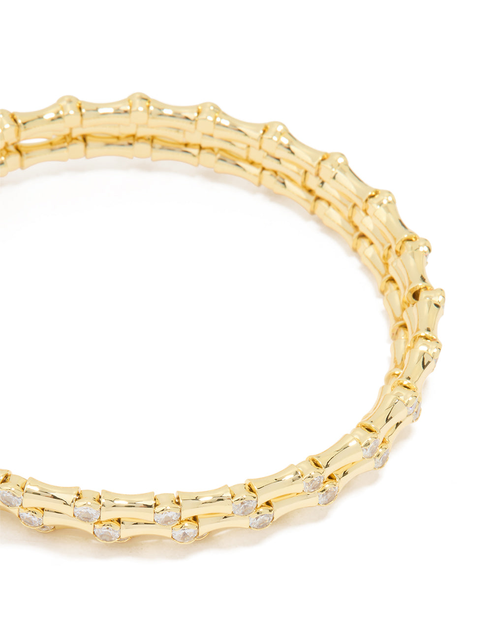 Discover this gold plated diamante spiral bangle close up view
