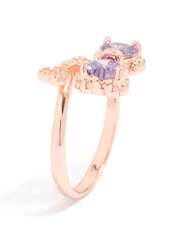 This elegant bow ring in rose gold with cubic zirconia highlights the band thickness and prong setting side detail view