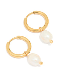 Showcasing waterproof gold plated stainless steel mini pearl drop charm huggie earrings in ivory front view - link has visual effect only