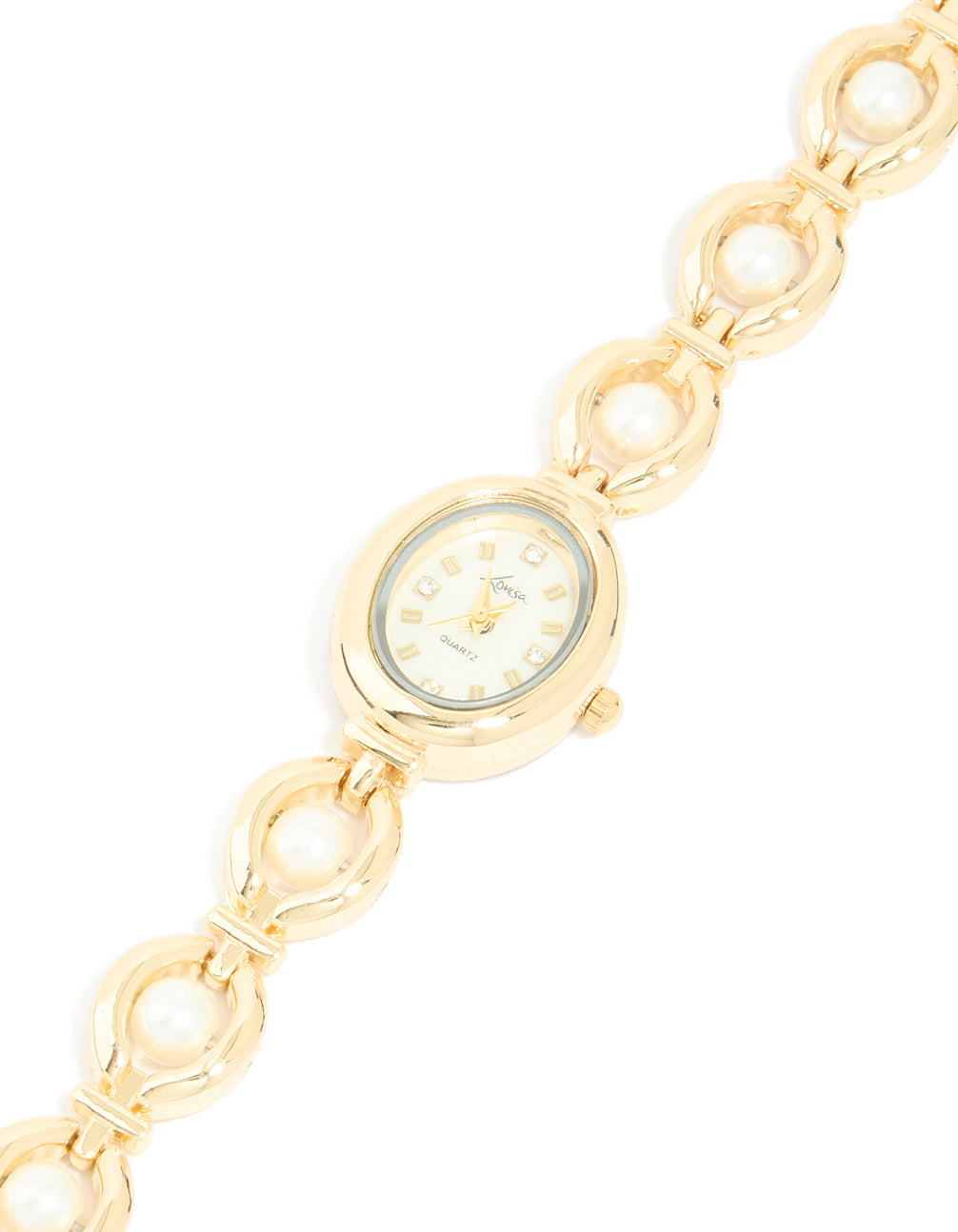 Discover a pearl embellished charm watch featuring white dial with numbers, casual occasion styling, analog movement, women's link-band bracelet in gold watch face detail view