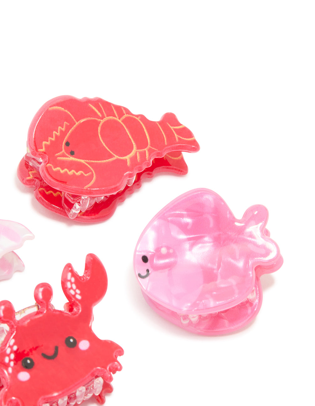 Featuring acrylic sea life claw clips 4-pack with ocean feature in pink, coral and black side view