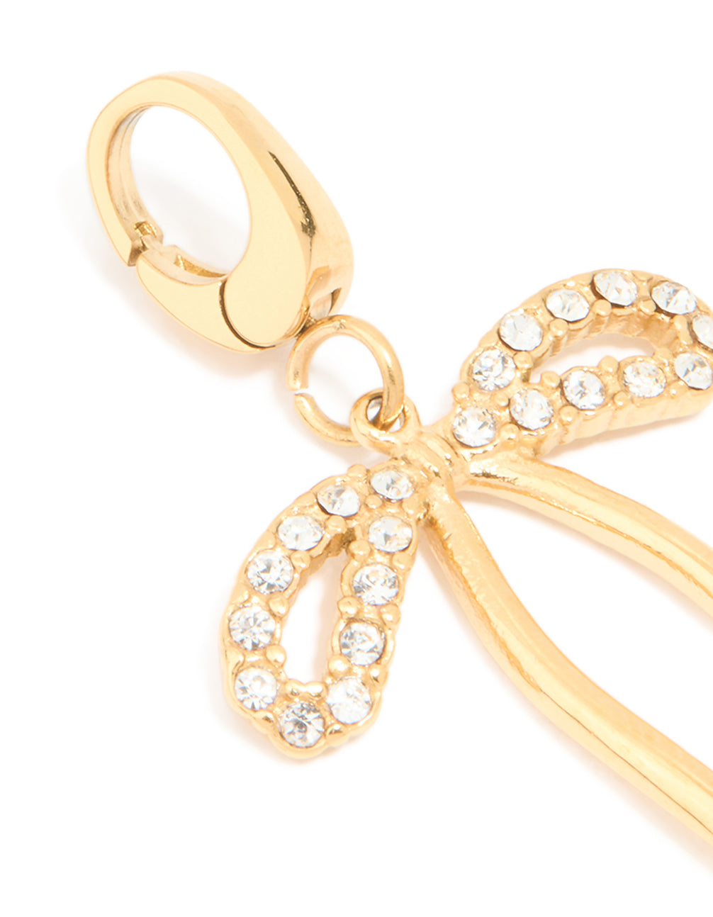 Showcasing a bow charm featuring waterproof stainless steel with pavé cubic zirconia in gold plated finish close up view