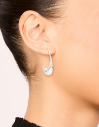 Featuring waterproof stainless steel thick half hoop earrings in silver on ear view - link has visual effect only