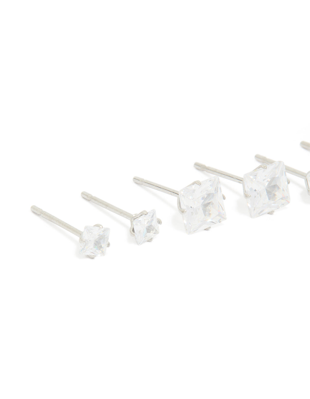 Designed with waterproof stainless steel cubic zirconia square stud earrings in a 3-pack featuring silver and clear stones close up view