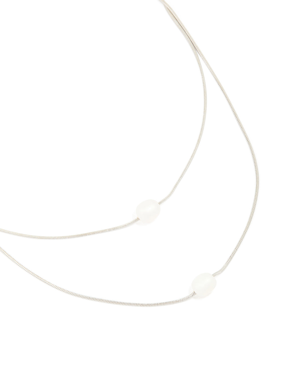 A waterproof stainless steel pearl layered necklace close up view