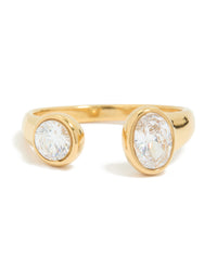 A waterproof gold plated stainless steel open ring highlighting oval and round cubic zirconia detail in close up view - link has visual effect only