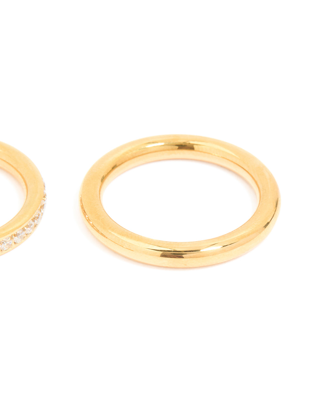 Presenting waterproof gold plated stainless steel cubic zirconia band and smooth rings in a 3-pack with statement style close up view