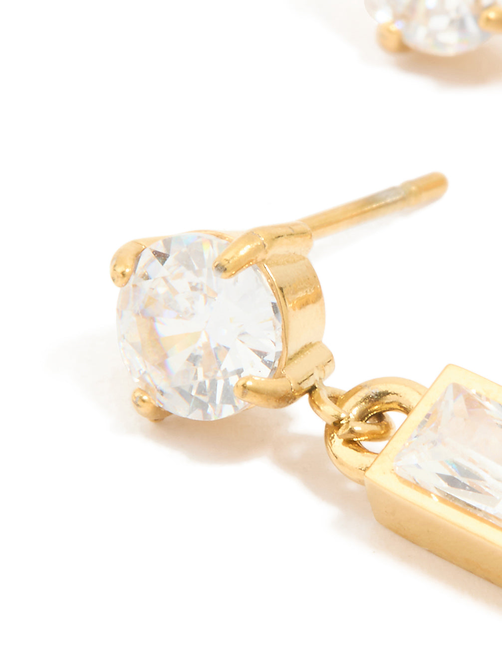 Highlighting waterproof drop earrings crafted from stainless steel featuring round stone cut cubic zirconia and gold plated finish close up view