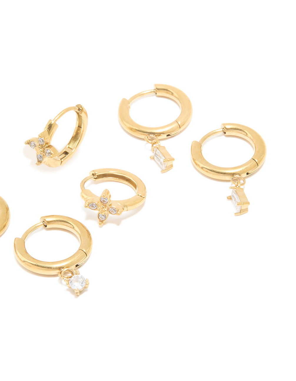 Crafted from waterproof gold plated stainless steel cubic zirconia huggie style earrings with butterfly charm featuring baguette stone cut and closure details on ear view