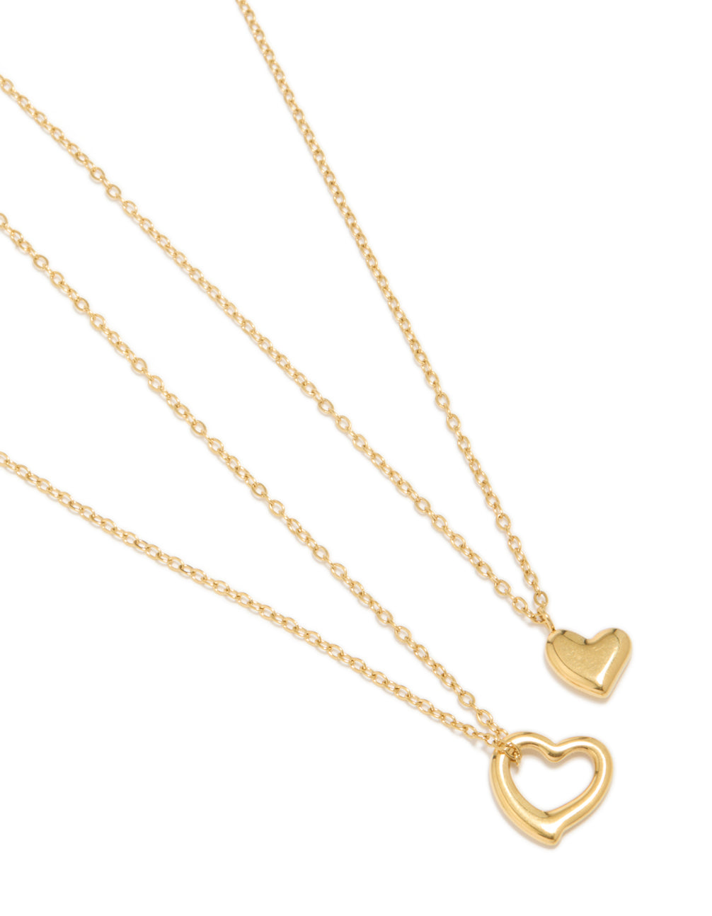 Featuring waterproof gold plated stainless steel cut out heart and solid heart pendant necklaces in a 2-pack close up view