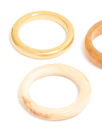 Designed with waterproof gold plated stainless steel and marbled stacking rings 3-pack close up view - link has visual effect only