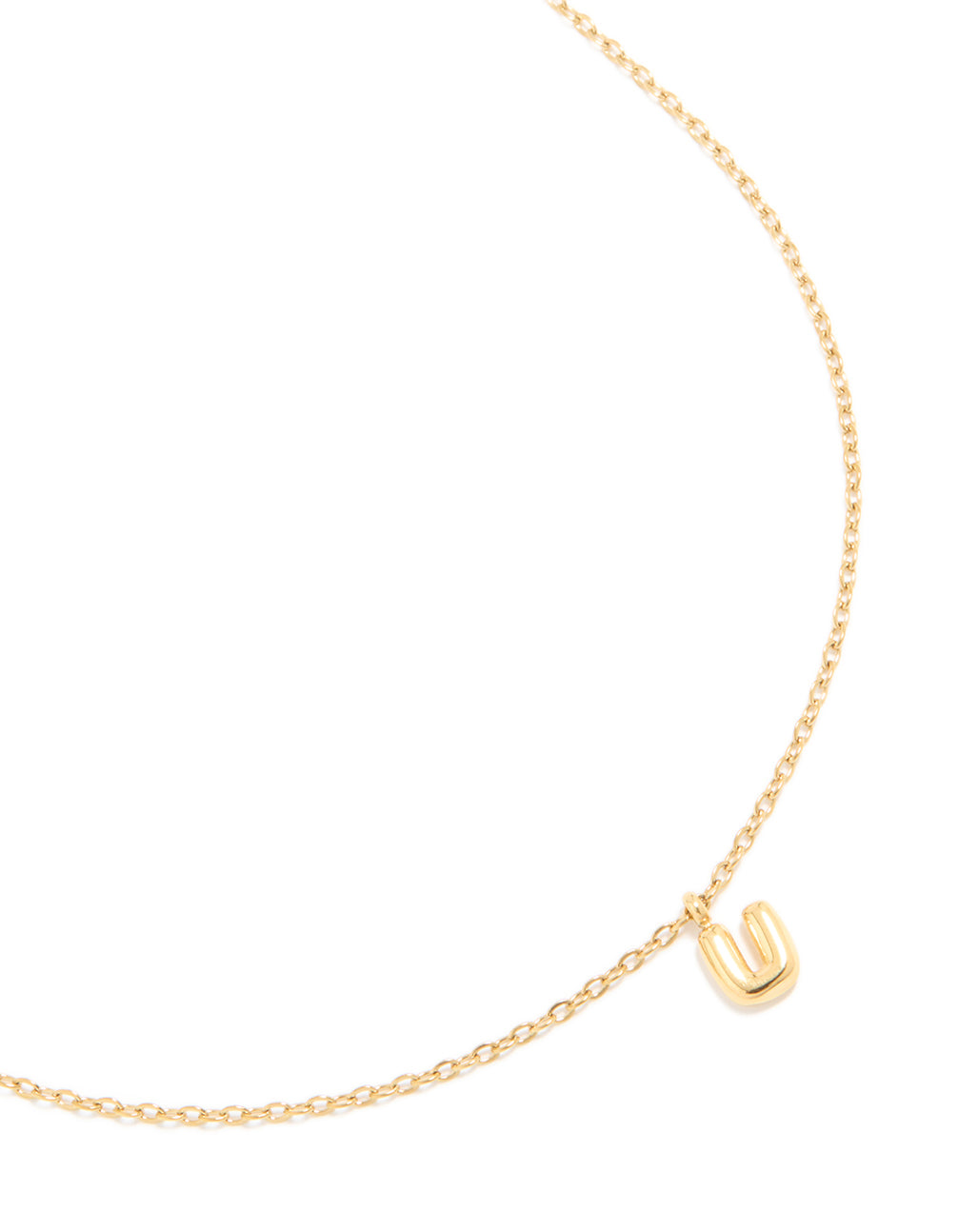 Showcasing a waterproof bubble letter U initial pendant necklace in gold plated stainless steel with a dainty style close up view