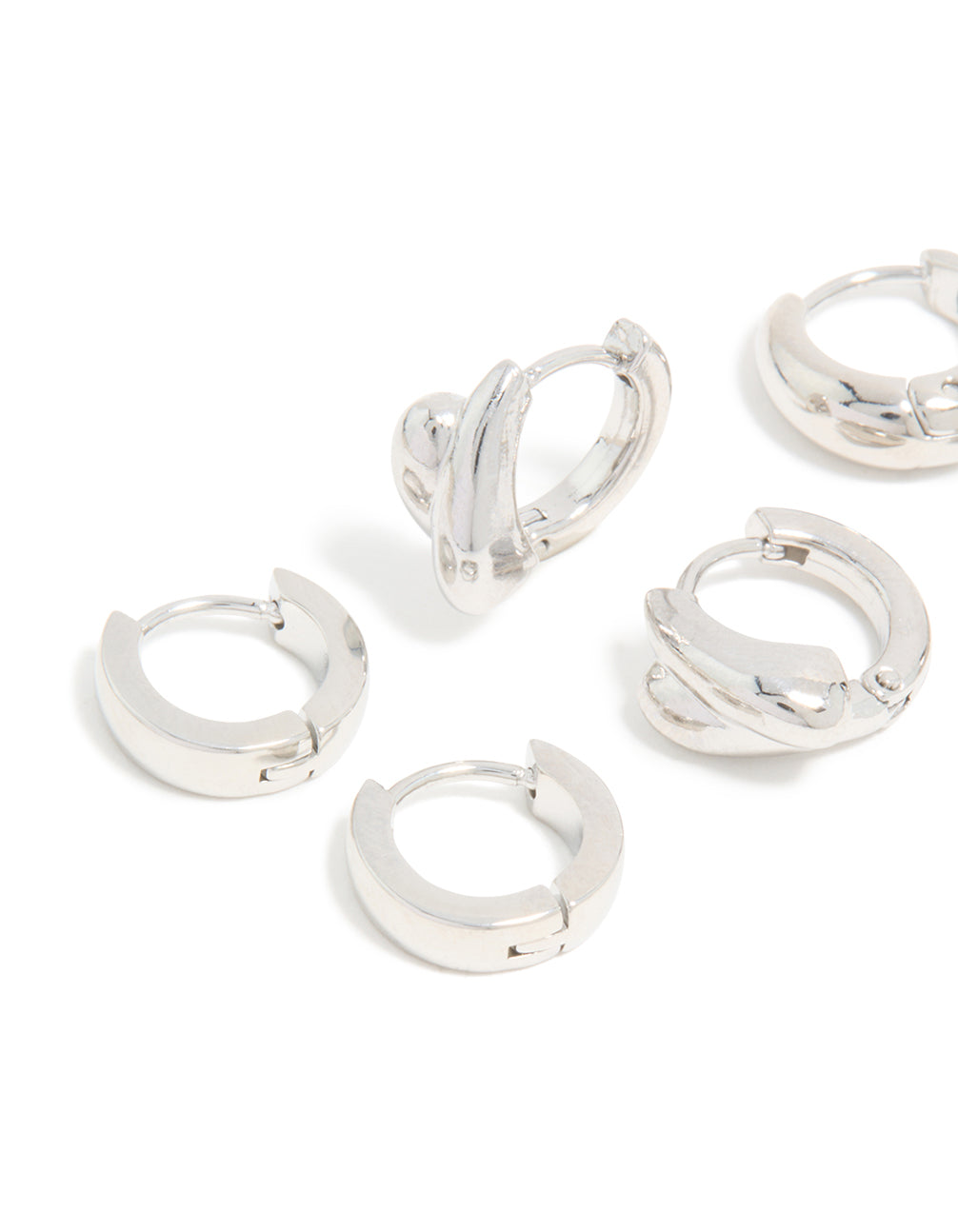 Explore chunky huggie earrings crafted in waterproof stainless steel with silver finish in a pack of 3 close up view