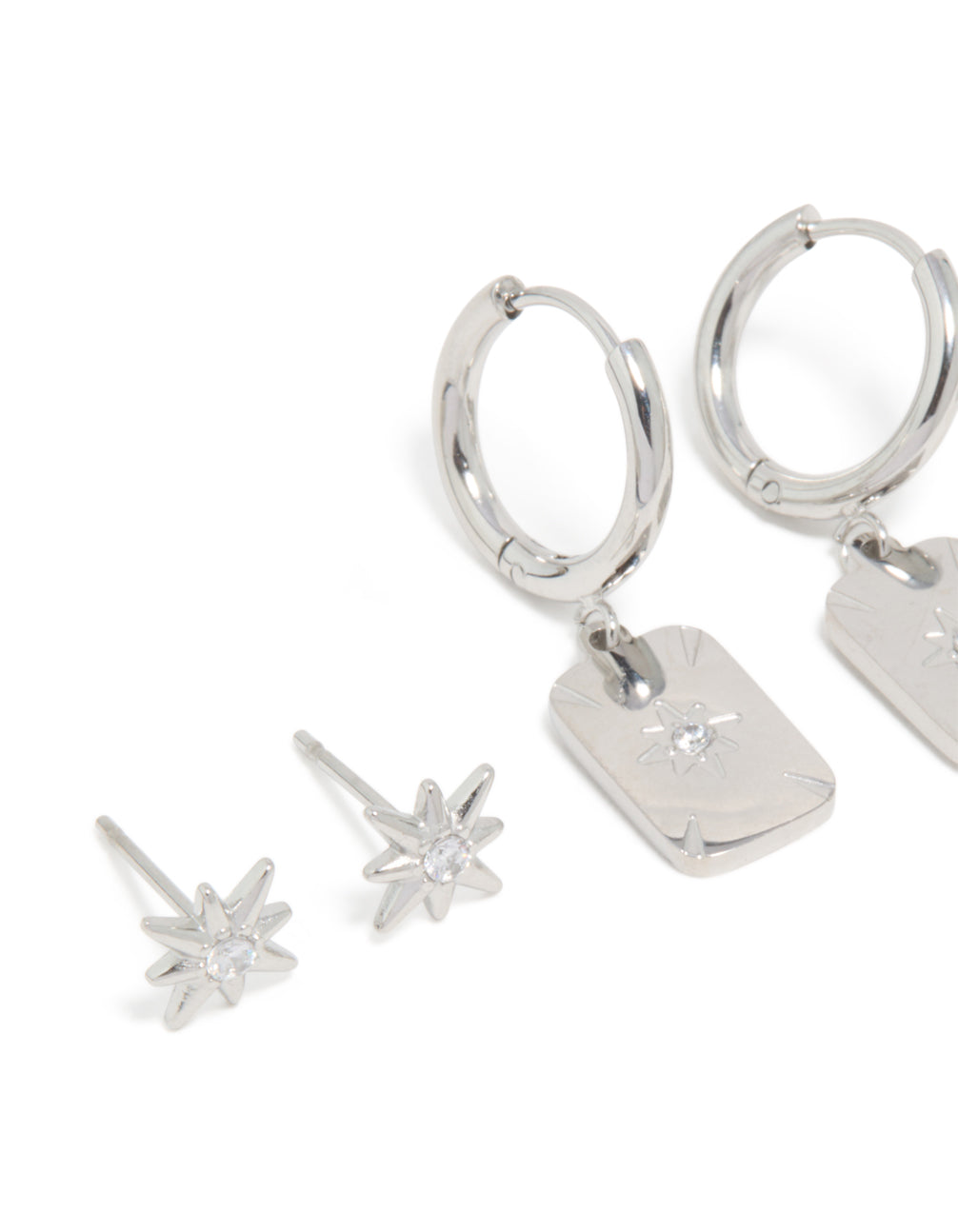 Crafted from waterproof stainless steel star and disc earrings in a 3-pack with celestial featuring stud and huggie closure in silver close up view