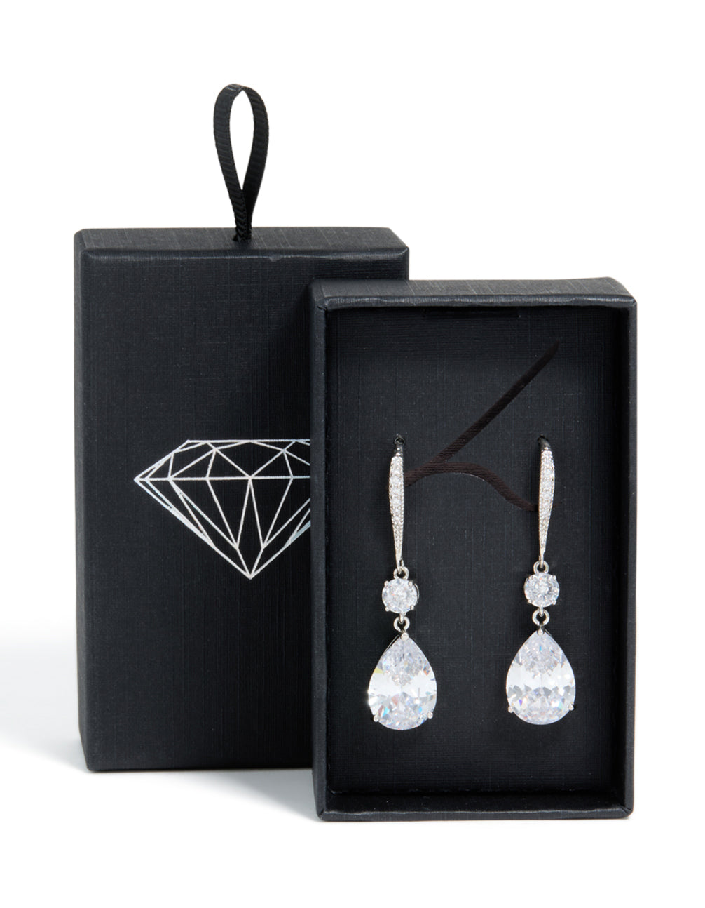Beautiful silver cubic zirconia pear drop earrings presented in black gift box with diamond logo side view